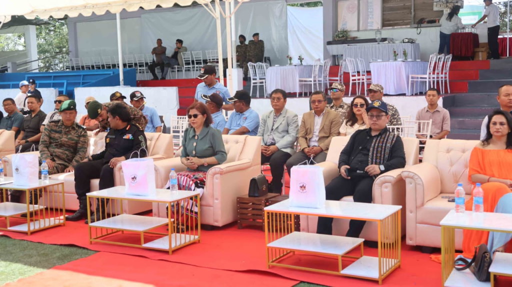 Minister Pi Lalrinpuii seated on stage with other dignitaries during the event.