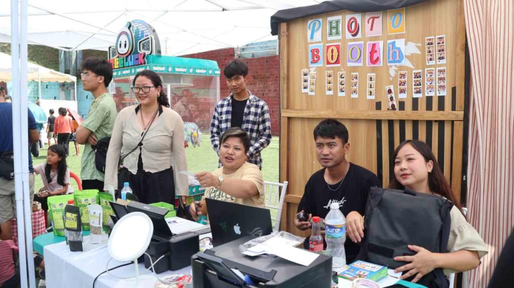 Photo Booth setup with young volunteers at the NCC Fest.