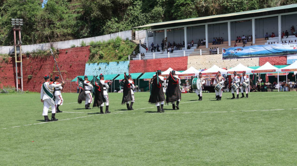 NCC cadets and band members marching on the ground during the event.